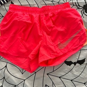 Pink Nike running shorts